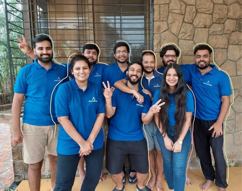 Docsumo team members in matching Docsumo shirts
